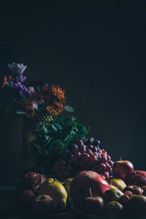 Dark baroque renaissance style still life photography of fruit and flowersの写真素材
