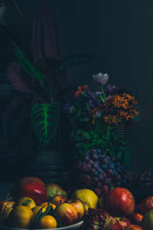 Dark baroque renaissance style still life photography of fruit and flowersの写真素材