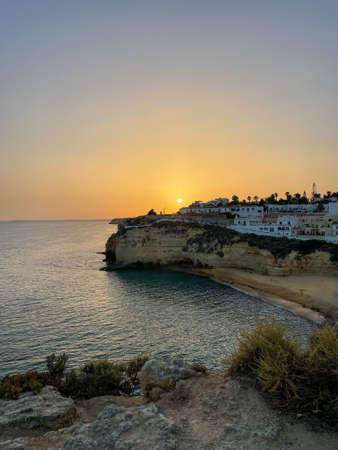 Sunset at Carvoeiro in the Algarve in Portugal.の写真素材