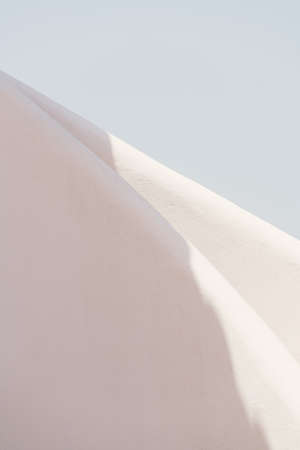 Detail of round shaped stairs of the entrance of a building. Minimal white.