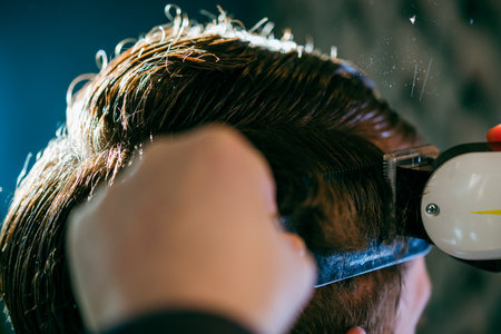 Barbershop close-up. Comb in hair and water spray.の写真素材