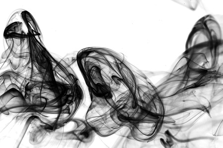 Floating colored smoke waves on solid background の写真素材