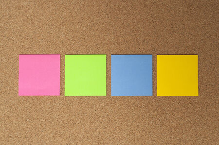 blank message paper pined on the bulletin cork boardの写真素材