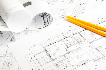 Construction planning drawings on the table and two yellow pencilsの写真素材