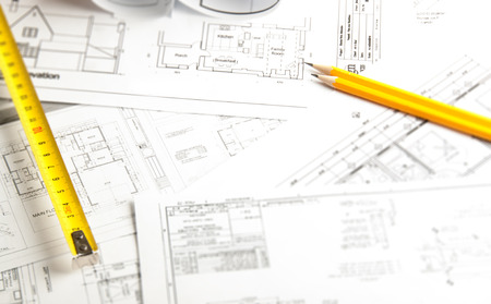 Construction planning drawings on the table and two yellow pencilsの写真素材