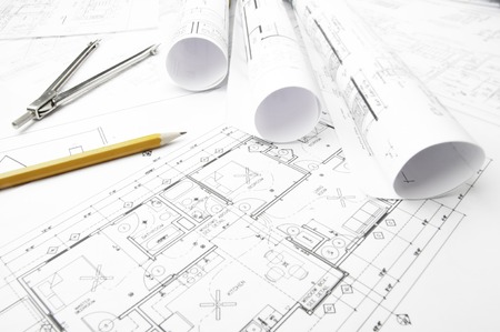 Construction planning drawings on the table and two yellow pencilsの写真素材
