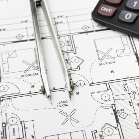 Construction planning drawings on the table and two yellow pencilsの写真素材