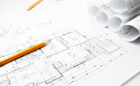 Construction planning drawings on the table and two yellow pencilsの写真素材