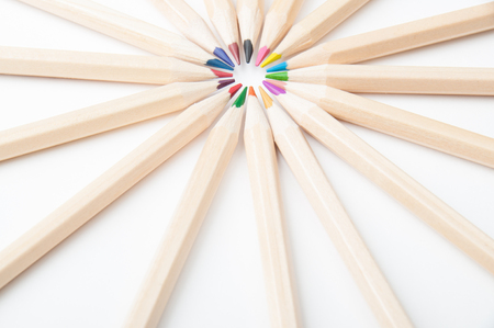 Colorful wooden pencils scattered on white backgroundの写真素材