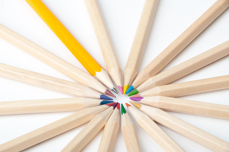 Colorful wooden pencils scattered on white backgroundの写真素材