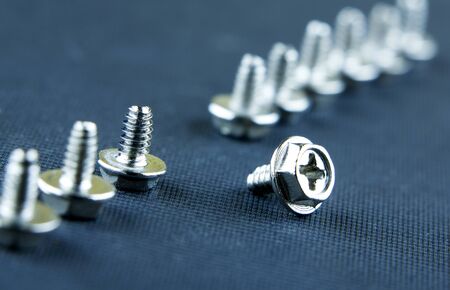 Abstract Shot Of Computer Screws On solid  Background