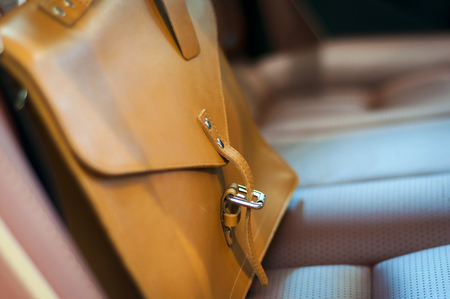Brown leather briefcase on the car back seatの写真素材