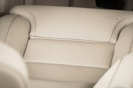 Leather car seats. Interior detail. Seam focused
