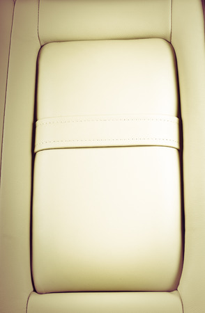 Part of  leather car seat with the unfocused car interior on the background, vintage filterの写真素材
