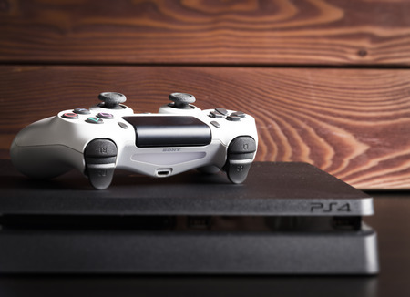 Sankt-Petersburg, Russia - 14 August, 2017: Sony PlayStation 4 Slim 1Tb revision and game controller...
