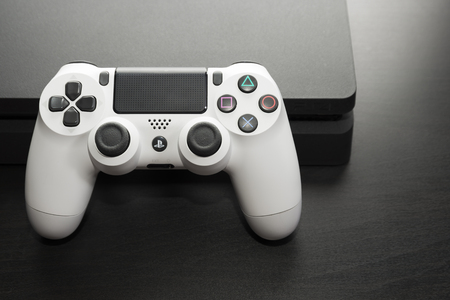 Sankt-Petersburg, Russia - 14 August, 2017: Sony PlayStation 4 Slim 1Tb revision and game controller