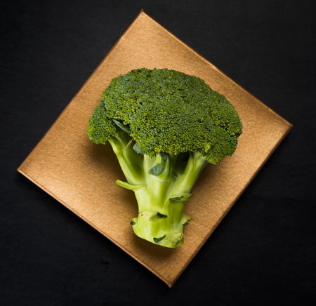 Green fresh broccoli on a dark surface. Studio shotの写真素材