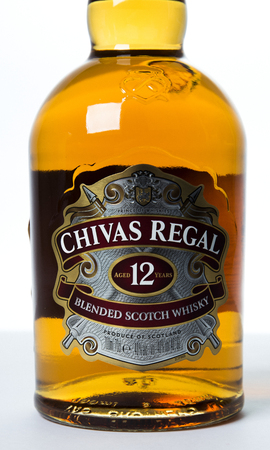 Saint-Petersburg, Russia - 26 August 2017: Studio shot of a bottle of Chivas Regal on white background, 12 years old scotch whiskey.Chivas Regal is a blended Scotch whisky produced by Chivas Brothers, owned by Pernod Ricard.のeditorial素材