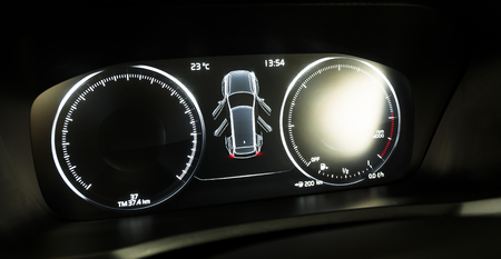 car interior dashboard details, led diaplay with speedometr, odometr ond image of a car with open...
