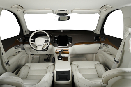 Luxury car inside. Interior of prestige modern car. Comfortable leather seats. White perforated leather cockpit with isolated white background.の写真素材