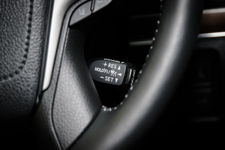 Cruise control switch button in modern car interior