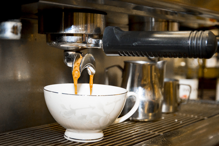 preparing coffee in automatic coffee machineの写真素材