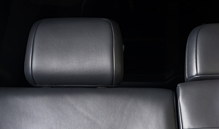 Modern luxury car  black leather interior. Part of  leather car seat details.