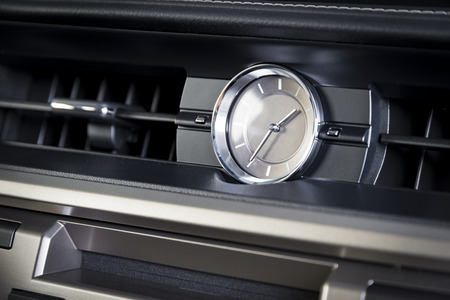 Watch in modern luxury car interior