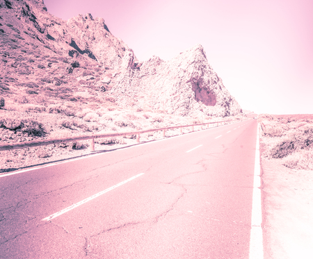 Asphalt Road in the mountains. Cinematic road landscape. Vintage style.の写真素材