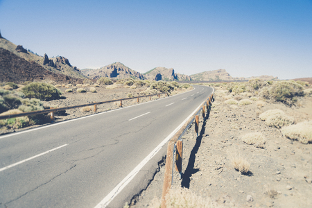 Asphalt Road in the mountains. Cinematic road landscape. Vintage style.の写真素材