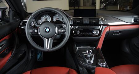Sankt-Petersburg, Russia, January 30, 2017 : BMW M4 car interior showing red leather cockpit, steering wheel and dashboard on test drive on January 30, 2017  in Russia, Sankt-Petersburgのeditorial素材