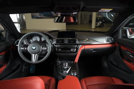 Sankt-Petersburg, Russia, January 30, 2017 : BMW M4 car interior showing red leather cockpit, steering wheel and dashboard on test drive on January 30, 2017  in Russia, Sankt-Petersburgのeditorial素材