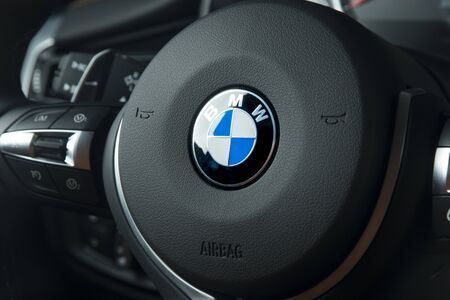 Sankt-Petersburg, Russia, January 30, 2017 : BMW logo in M4 car interior ssteering wheel, test drive...