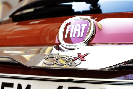 Verona, Italy - 9 December 2018: Fiat 500 logo on the red color car parked on the street.のeditorial素材