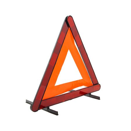 Emergency reflective car warning triangle used to warn others of a broken down vehicle, a legal requirement in most European countries, isolated on a white backgroundの写真素材