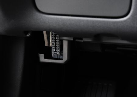 Automotive Electronic Diagnostic port OBD II under car dashboardの写真素材