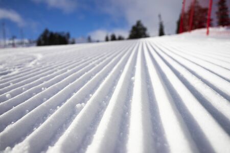 Ready ski piste after snow cat and snow grooming with velvet textureの写真素材