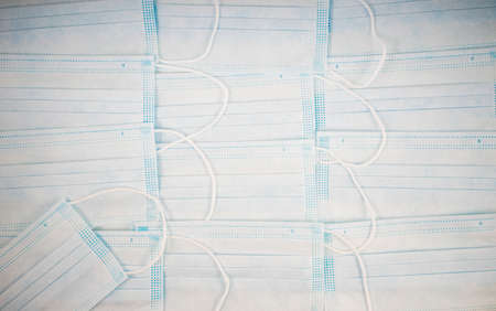 White medical masks background. Medical protective masks over light background. Healthcare and...