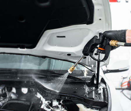 Car detailing maintenance, cleaning engine with the high pressure cleanerの写真素材