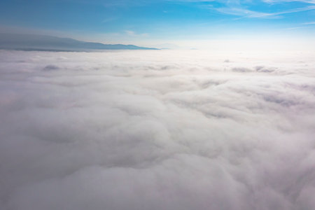 Aerial top view cloudscape. Texture of clouds. View from above. Sunrise or sunsetÂ overÂ clouds...