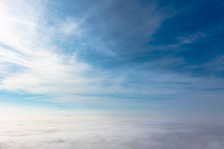 Aerial top view cloudscape. Texture of clouds. View from above. Sunrise or sunsetÂ overÂ clouds...