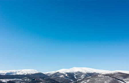 Winter snow covered mountain peaks in Caucasus. Great place for winter sports