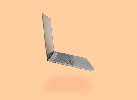 Photo of realistic modern laptop floating in front of a light backgroundの写真素材