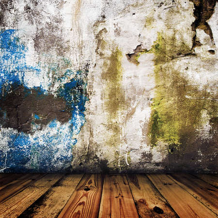 grunge painted wall and wooden floor in a roomの写真素材