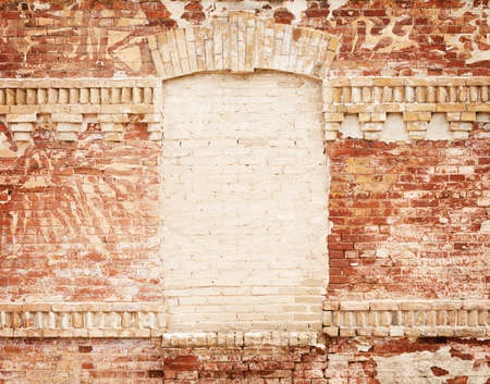 grunge brick wall with blank frame in the centreの写真素材