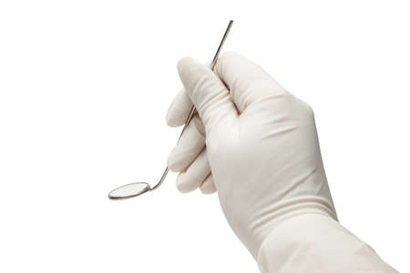 hand holding mirror isolated over white. dentist examination