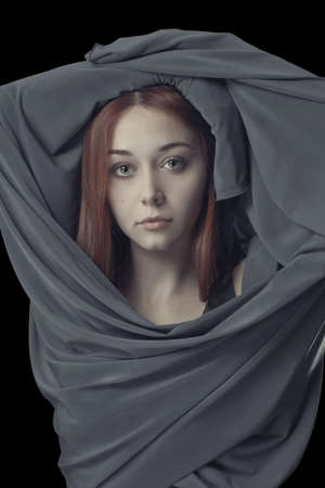 portrait of young girl with grey clothの写真素材