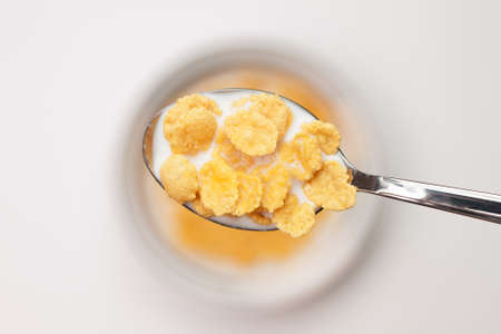 spoon full of cornflakes close-up breakfast conceptの写真素材