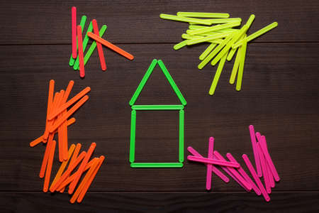 house formed with green counting sticks conceptの写真素材