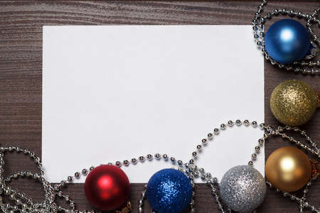 shiny christmas decoration with blank sheet of paperの写真素材